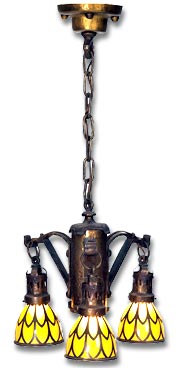 arts and crafts chandelier - hammered brass fixture with three brackets supporting gold glass shades with copper overlay design