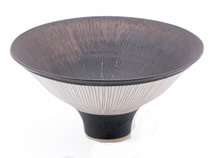 antique marks - LUCIE RIE Flaring porcelain bowl radiating with sgraffito lines on bronze glaze interior and matte white exterior. Marked LR