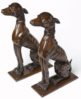 Matching pair of antique bronze mahogany venetian dogs