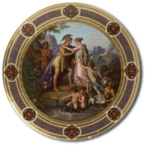 An early 20th century Vienna circular charger the gilt border with stylised foliate bands and cartouche panels, the well painted with a neo-Classical scene of Peleus and Thetis, with cherubic figures with fortresses in the background, overpainted blue beehive mark and painted 'Peleus u Thetis', and impressed Z over 4 - auction estimate £800-1,200