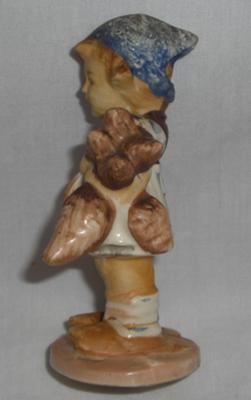 Side view of Possible Hummel Girl Figurine