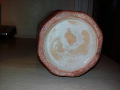 Bottom of rust colored vase